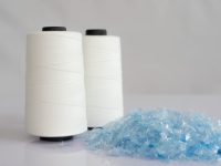 Bottle flake,PET bottle flake,Plastic bottle crushed,Small pieces of cut blue plastic bottles & Raw White Polyester FDY Yarn spool with white background Recycled polyester