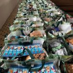 Lining up the Christmas food packs ready for distribution