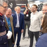 The Lord-Lieutenant of Devon chatting with a NASA engineer at Heathcoat's Queen's Award Presentation event